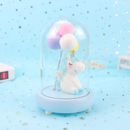 Yksisarvinen ilmapalloilla lasikuvussa yövalo