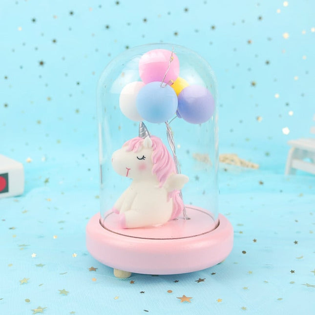 Yksisarvinen ilmapalloilla lasikuvussa yövalo