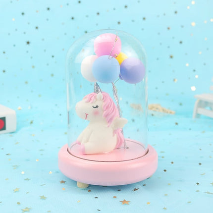 Yksisarvinen ilmapalloilla lasikuvussa yövalo