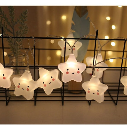 Valkoinen LED-valosarja hymyilevillä tähdillä