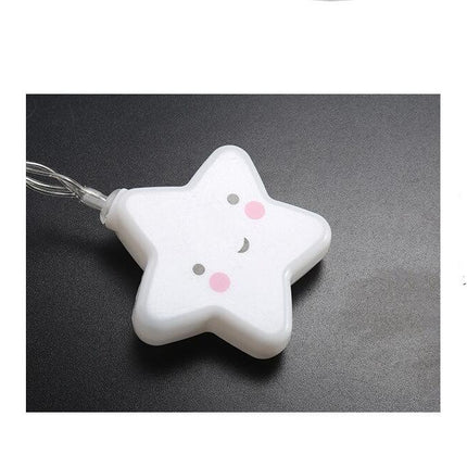 Valkoinen LED-valosarja hymyilevillä tähdillä